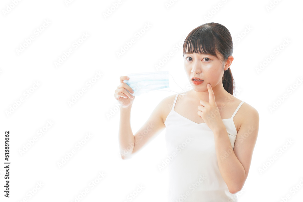 Young woman suffering from rough skin because of wearing a mask Young woman suffering from rough skin because of wearing a mask