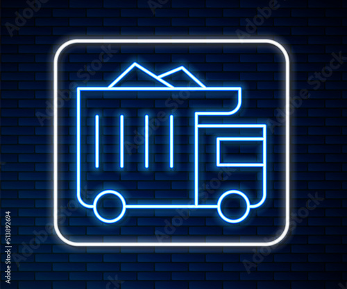 Glowing neon line Large industrial mining dump truck icon isolated on brick wall background. Big car. Vector