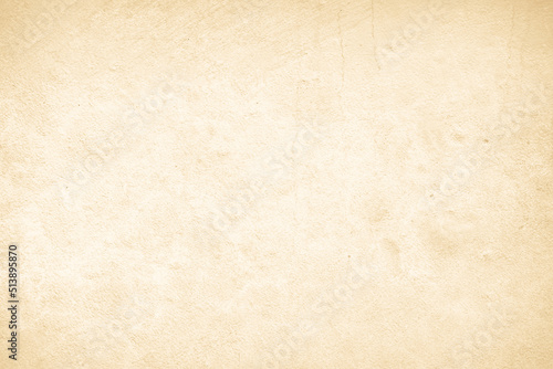 Old concrete wall texture background. Close up retro plain cream color cement material surface.
