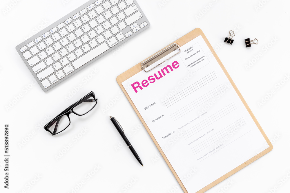 We are hiring. Resume application form on office table We are hiring. Resume application form on office table