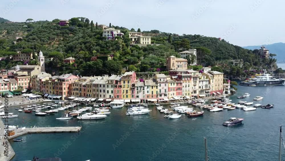Europe, Italy , Portofino, Liguria - Drone aerial view of Portofino harbor with typical colored houses - boats and amazing sea bay surrounded by nature in Portofino natural park - Tourist attraction Europe, Italy , Portofino, Liguria - Drone aerial view of Portofino harbor with typical colored houses - boats and amazing sea bay surrounded by nature in Portofino natural park - Tourist attraction