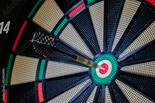 Touch the heart of the target. Objective to be achieved. Darts, sport for young and old.