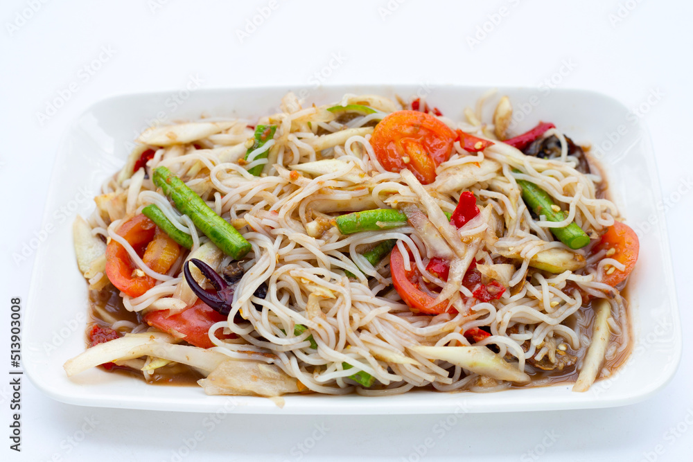 Spicy green papaya salad with vermicelli on white