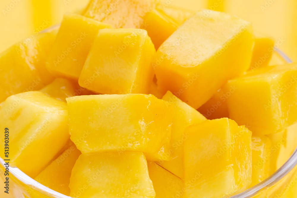Yellow mango cube slices in glass bowl