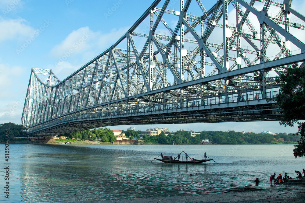 Iconic Howrah Bridge Or Rabindra Setu Of Kolkata And Boat In River 