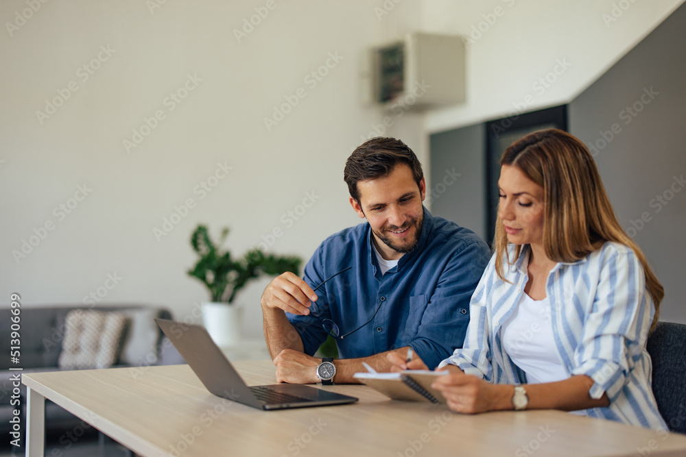 Focused businesswoman showing something to her male colleague, her notes. Focused businesswoman showing something to her male colleague, her notes.