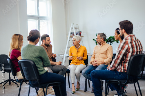 Canvastavla A wide ankle of people attends the group therapy, talking to each other
