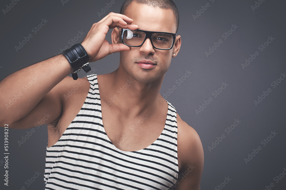 Man fashion model posing against a studio background Man fashion model posing against a studio background