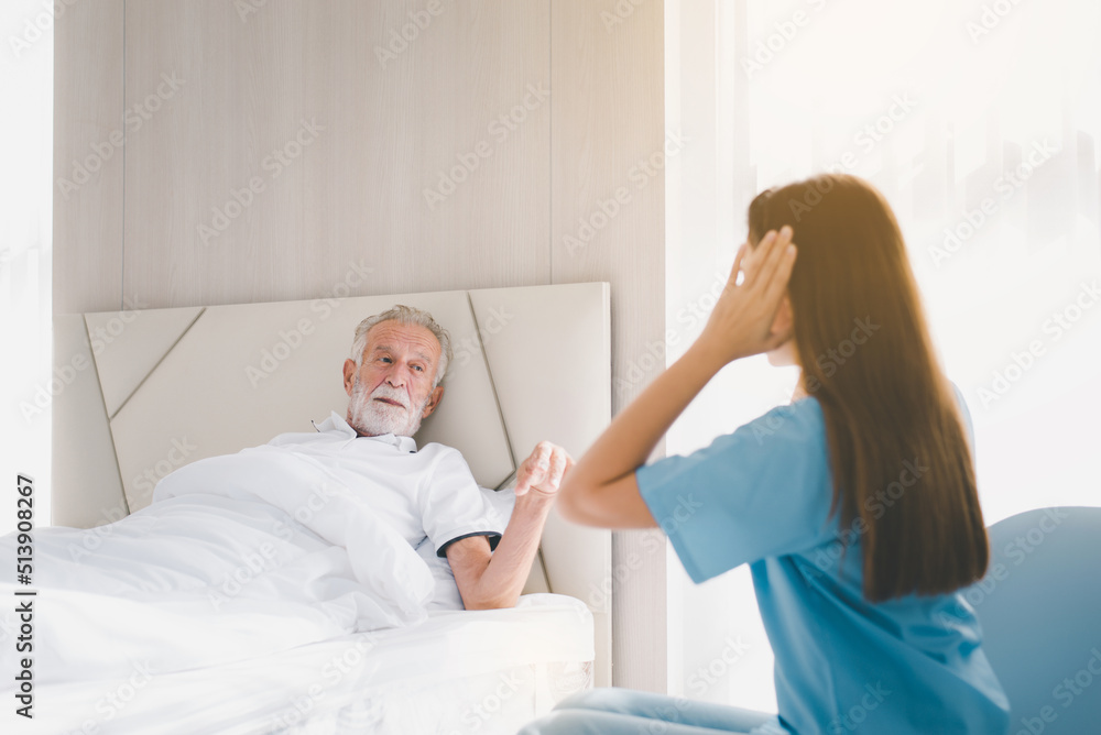 Senior men talking with caregiver in room,Nursing care home concept Senior men talking with caregiver in room,Nursing care home concept