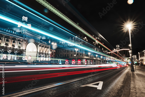 Long exposure car lights in Moscow. Bus lane in the city. Big city buildings at night. © AngelinaProtein
