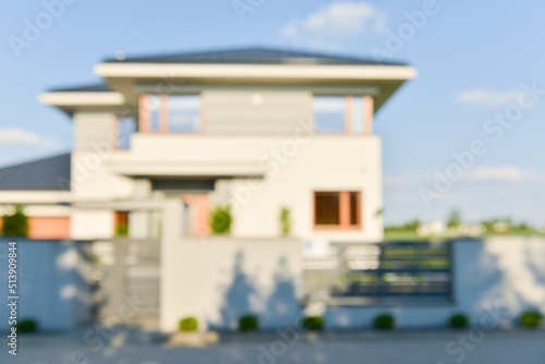 Blurred view of modern house on sunny day © New Africa