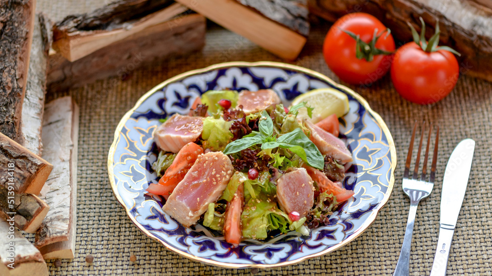 fresh salad with tuna on a patterned plate fresh salad with tuna on a patterned plate