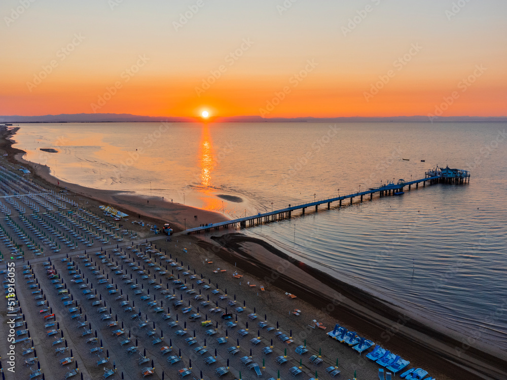 Obraz premium Sunrise in Lignano Sabbiadoro seen from above. From the sea to the lagoon, the city of holidays