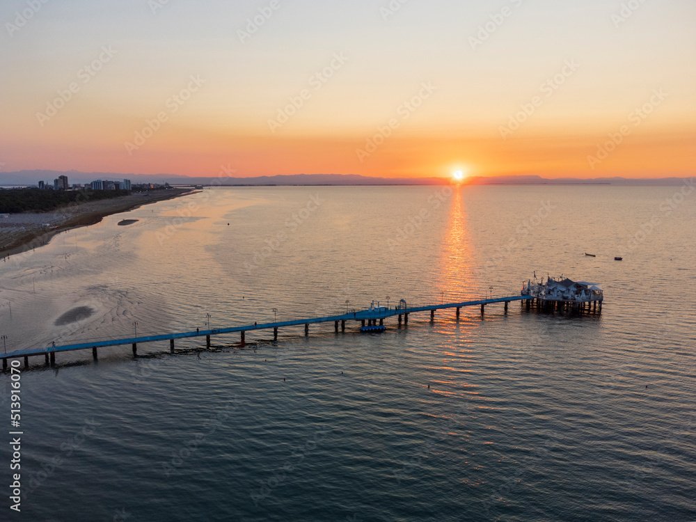Sunrise in Lignano Sabbiadoro seen from above. From the sea to the lagoon, the city of holidays