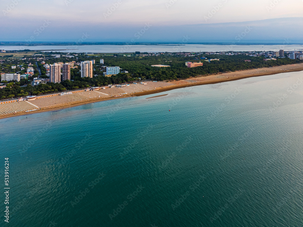 Sunrise in Lignano Sabbiadoro seen from above. From the sea to the lagoon, the city of holidays