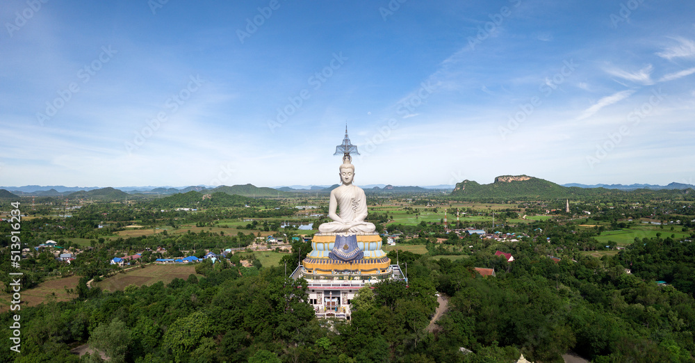 Panorama View of white Buddha surround with mountain. Ratchaburi, Thailand