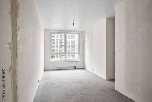 Interior of new apartment without finishing in gray tones