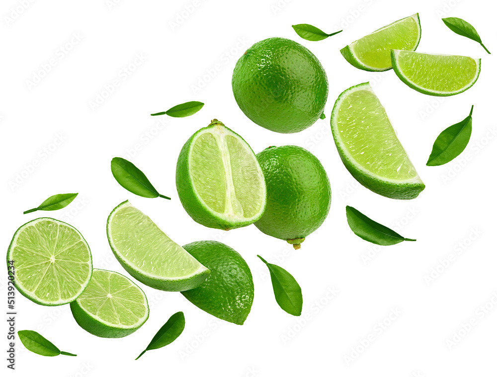flying green limes with slices and green leaves isolated on white background. clipping path flying green limes with slices and green leaves isolated on white background. clipping path