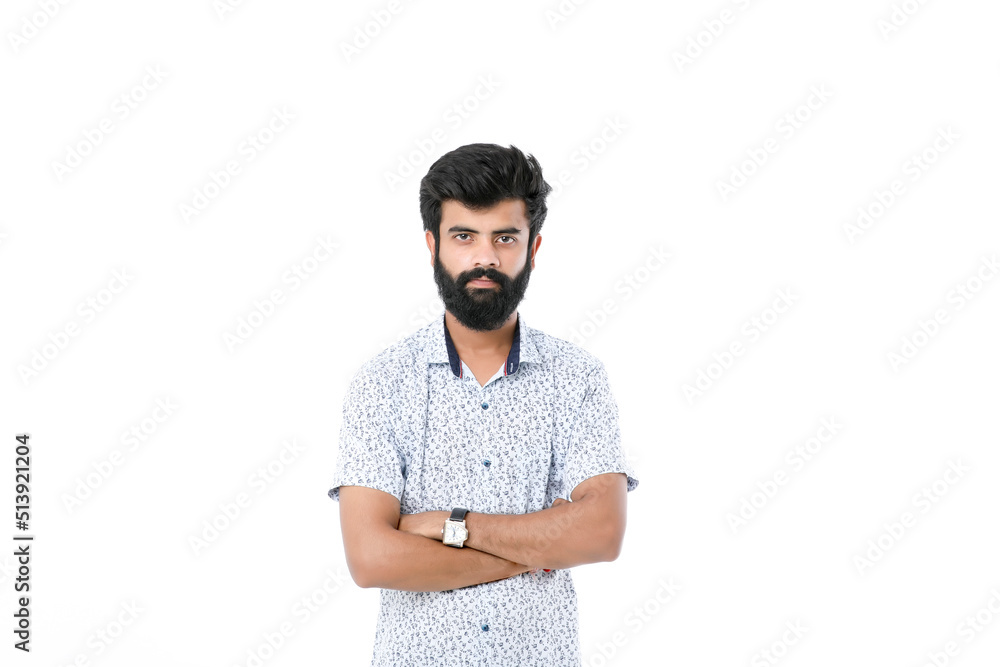 Fototapeta premium Young indian man giving expression over white background.