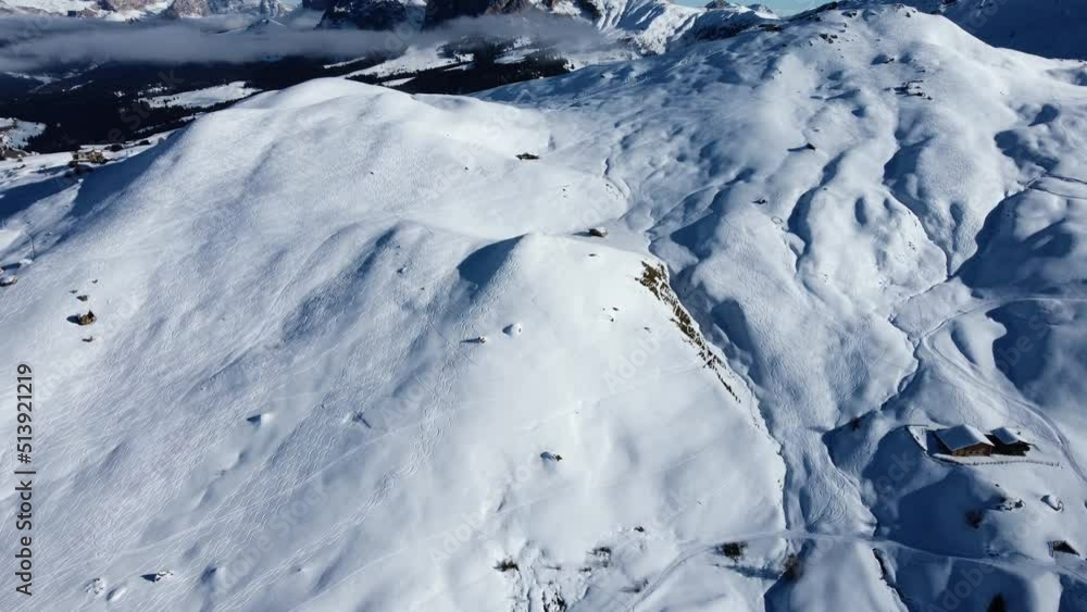 Short pan up shot from the winter season in the Italian Dolomites, slowly revealing Sassolungo in a distance Short pan up shot from the winter season in the Italian Dolomites, slowly revealing Sassolungo in a distance