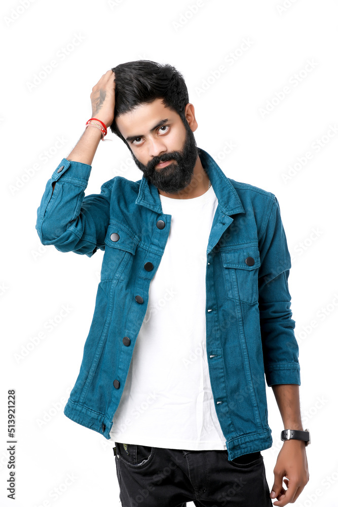 Young indian man wear jacket and giving expression over white background. Young indian man wear jacket and giving expression over white background.