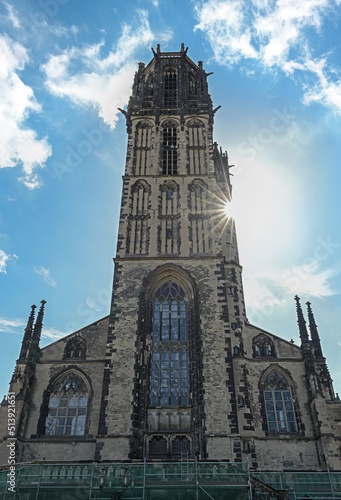 Tower of the St. Salvator Church Duisburg, the Gothic basilica is today a Protestant city church, blue sky with white clouds, Germany, Europe