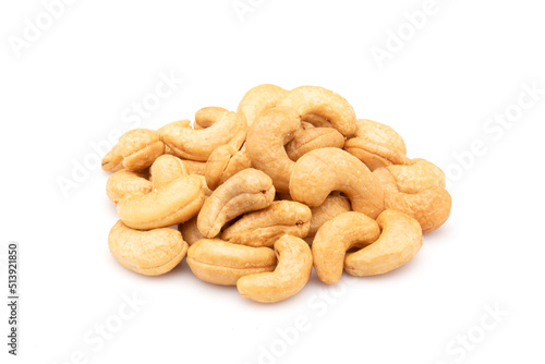 Pile of roasted cashew nut isolated on white background. Food concept