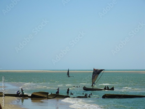 People and yachts at Morondava Beach, Madagascar © marimos