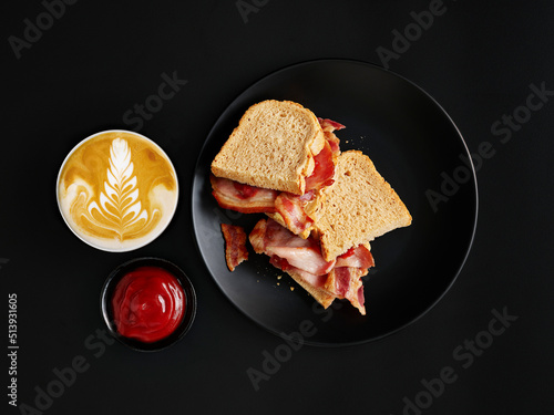 Hearty breakfast with ham on toast and cappuccino photo
