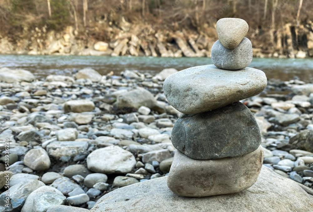 pyramid made of stones on the bank of a mountain river pyramid made of stones on the bank of a mountain river