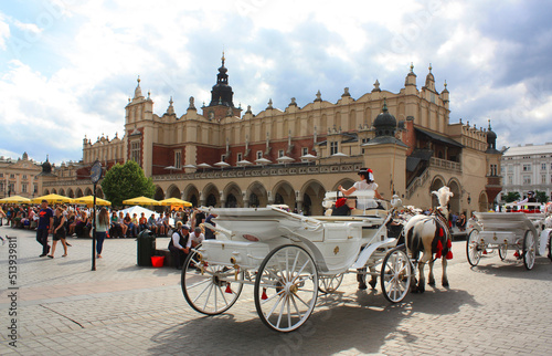 Sukennice and coach on the main square of Krakow, Poland