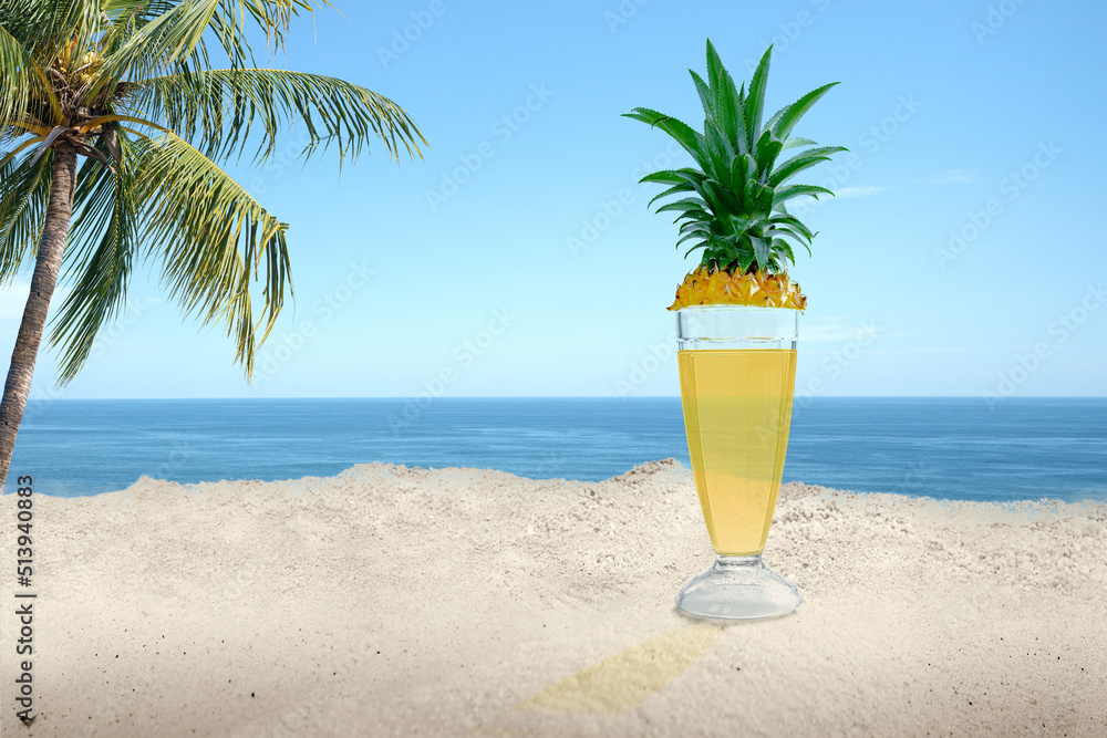 Pineapple juice in the glass on the beach