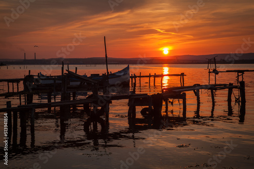 Old fishing boats at sunset on Varna Lake