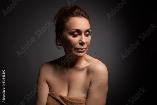 Wallpaper Mural portrait of a sensual fifty year old woman on grey studio background Torontodigital.ca