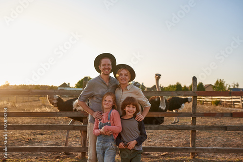 Fényképezés Happy family near paddock with ostriches on ranch