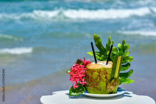 Obraz na plátne aphrodisiac drink served in a coconut on brazilian beach, porto galinha