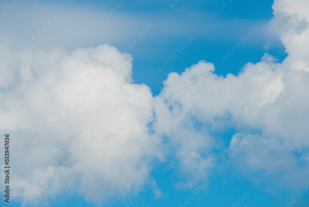 clouds kissing on the sky .blue sky with white clouds for banner card wallpaper background