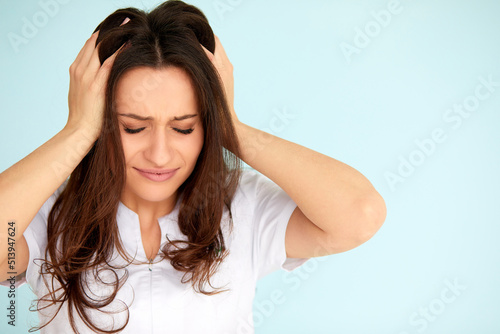 Headache And Stress. Beautiful Young Woman Feeling Strong Head Pain. Portrait Of Tired Stressed Female Suffering From Painful Migraine, Holding Hands Near Face. Health Care Concept. High Resolution