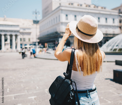 Young attractive smiling girl tourist in hat exploring new Europe city at summer holiday © Vasily Makarov