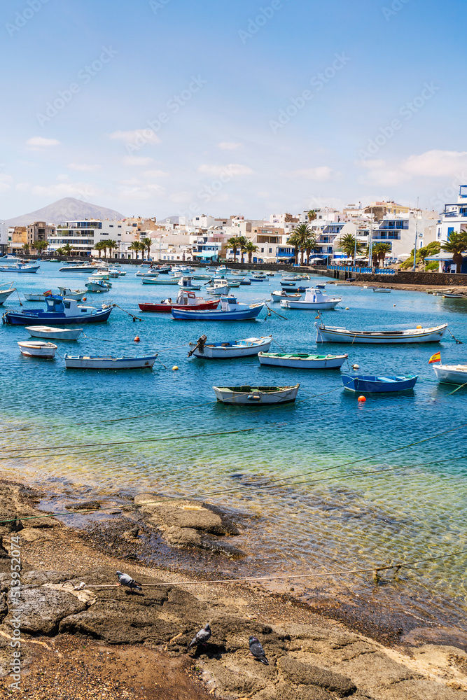 Beautiful downtown of Arrecife with many boats floating on blue water, Lanzarote, Canary Islands, Spain Beautiful downtown of Arrecife with many boats floating on blue water, Lanzarote, Canary Islands, Spain