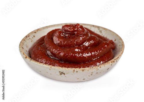 Bild auf Leinwand Gochujang or Korean red chili paste in a ceramic bowl isolated on white background with a clipping path