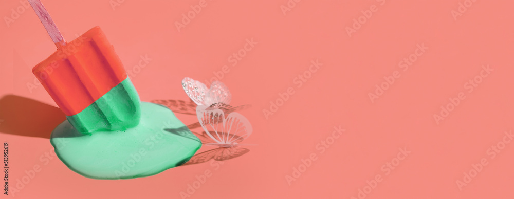 Colored ice cream melts from the hot sun. Butterflies eat sweet ice cream. Banner with copy space Colored ice cream melts from the hot sun. Butterflies eat sweet ice cream. Banner with copy space