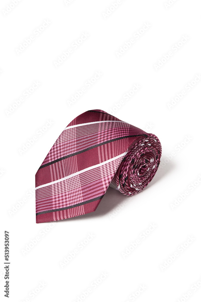 Close-up shot of an elegant plaid tie in burgundy with white and black stripes. The plaid tie is rolled and isolated on a white background. Top view. Close-up shot of an elegant plaid tie in burgundy with white and black stripes. The plaid tie is rolled and isolated on a white background. Top view.