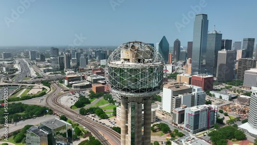 Downtown Dallas TX skyline. Major corporate Fortune 500 headquarters in Texas city. Aerial orbit of Reunion Tower. photo