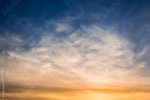 Bizarre multicolored clouds in blue sky at sunset © Gabdulvachit