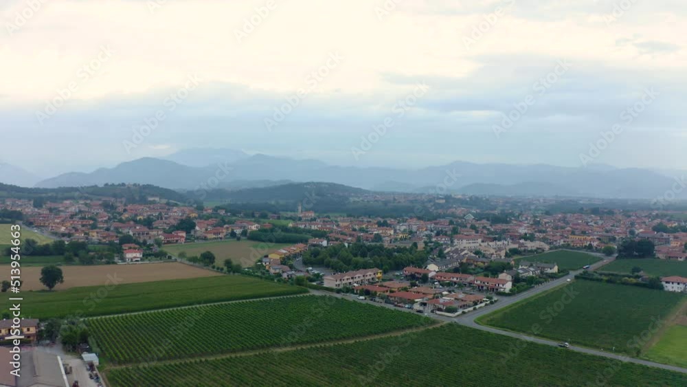 Drone view of a vineyard. rows of green grape vines and brown hills in the background. Flying over a french vineyard. Drone view of a vineyard. rows of green grape vines and brown hills in the background. Flying over a french vineyard.