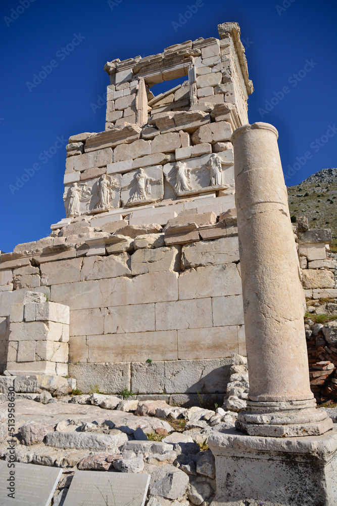 ancient town Sagalassos with ancient building and columns on blue background
