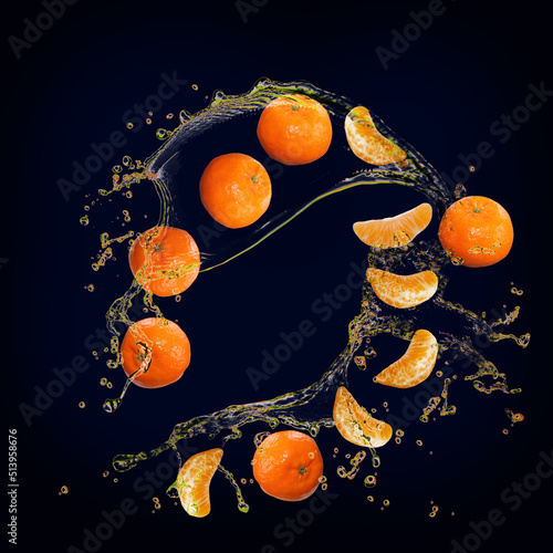 Fototapeta Naklejka Na Ścianę i Meble -  Juicy tasty tangerine with splashes of juice is very healthy
