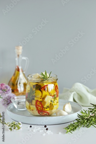 Marinated Feta or Halloumi Cheese with Garlic Infused Oil. Copy space