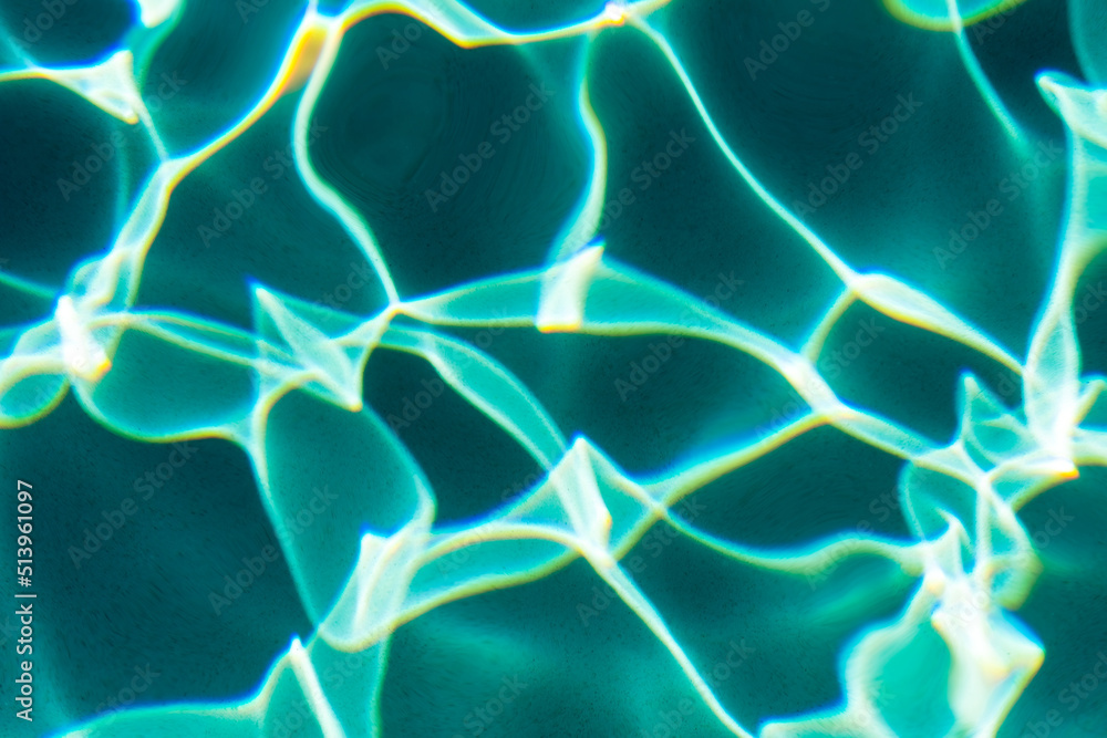 Sunflecks on emerald water surface in a swiming pool Sunflecks on emerald water surface in a swiming pool